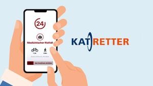 Smartphone mit der Katretter-App auf dem Bildschirn, daneben das Logo